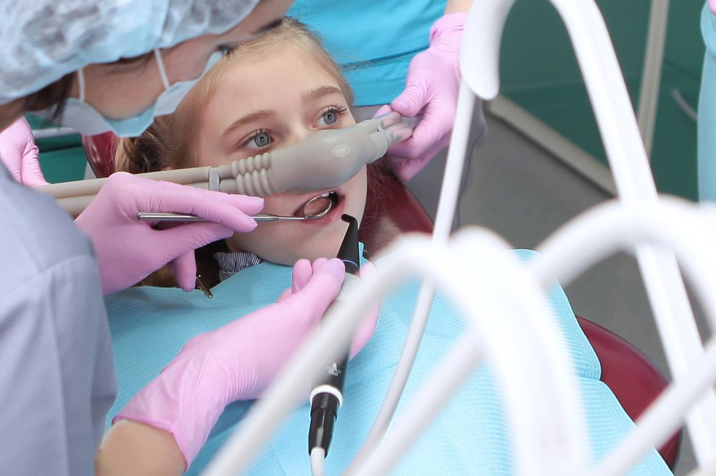 a young girl receiving sedation dentistry in Greenville, SC
