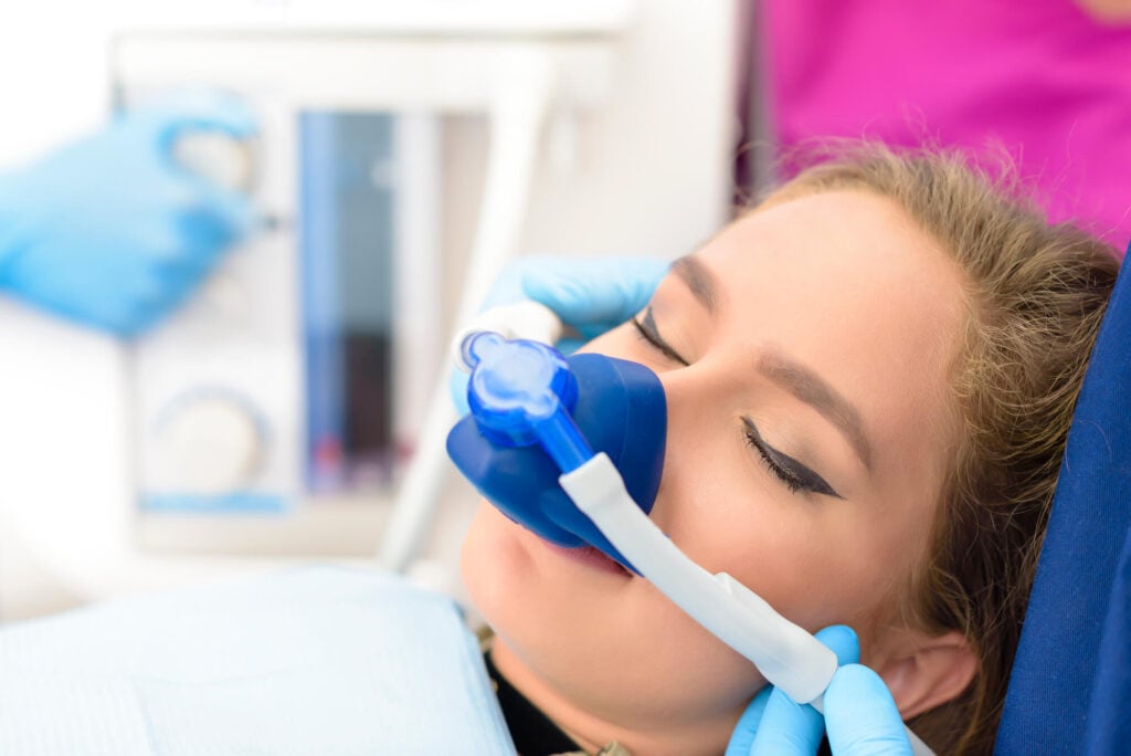 woman at dental chair during sedation dentistry in Simpsonville SC